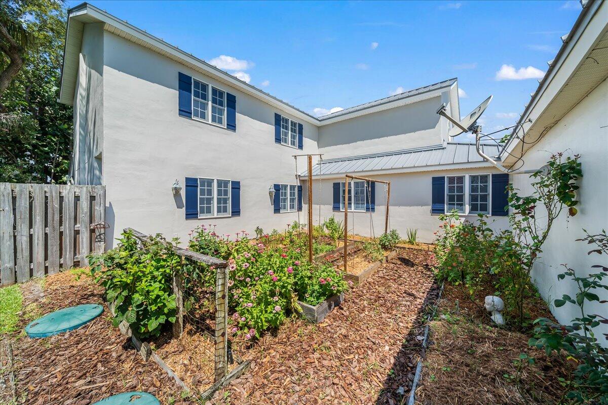 1650 North Riverside Drive Indialantic, FL 32903 - Photo 77 of 88 a front view of a house with garden
