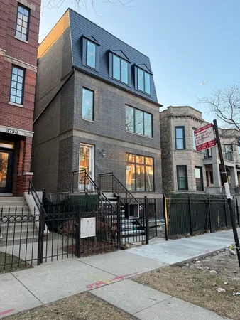 a front view of a building with a porch