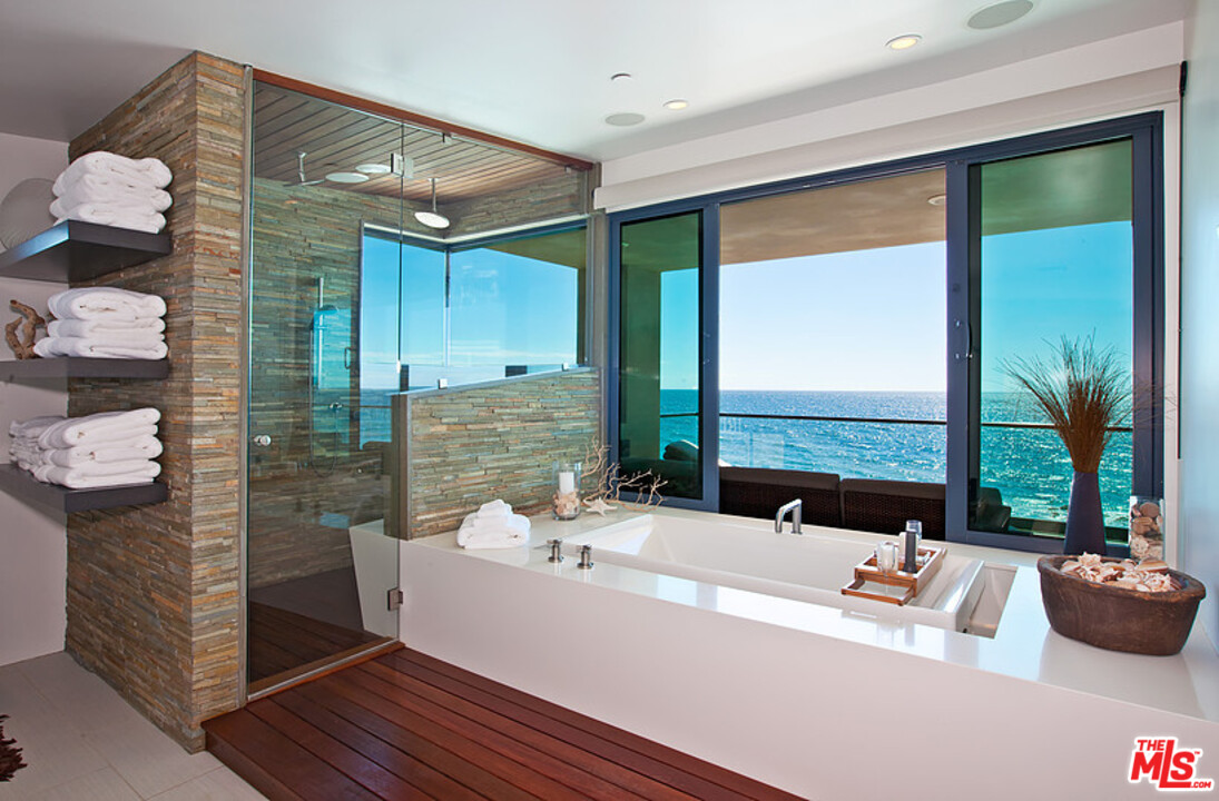 25250 Malibu Road Malibu, CA 90265 - Photo 18 of 31 a large white kitchen with a large window and sink