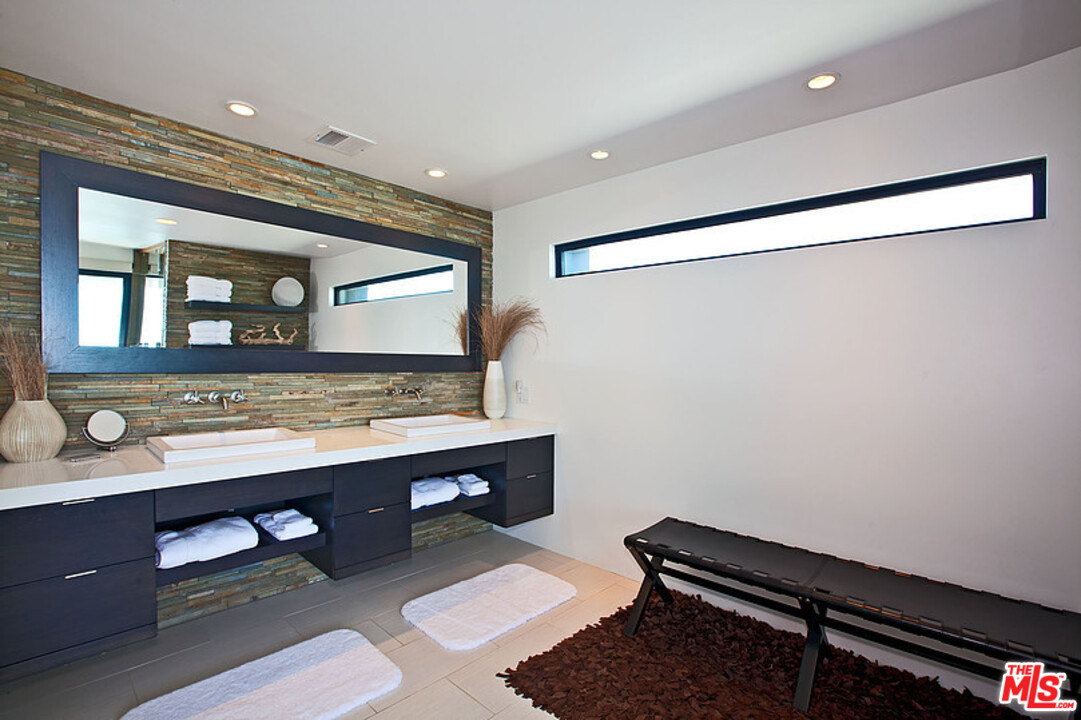 25250 Malibu Road Malibu, CA 90265 - Photo 19 of 31 a room with a sink a desk and chair