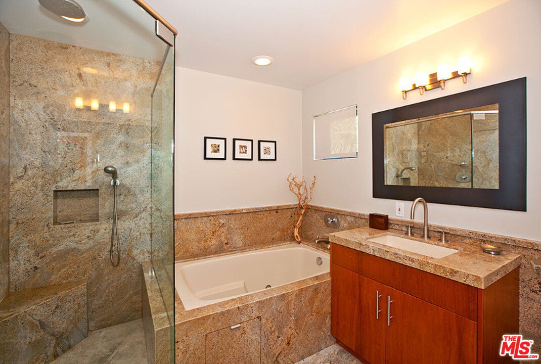 25250 Malibu Road Malibu, CA 90265 - Photo 24 of 31 a bathroom with a tub sink and mirror