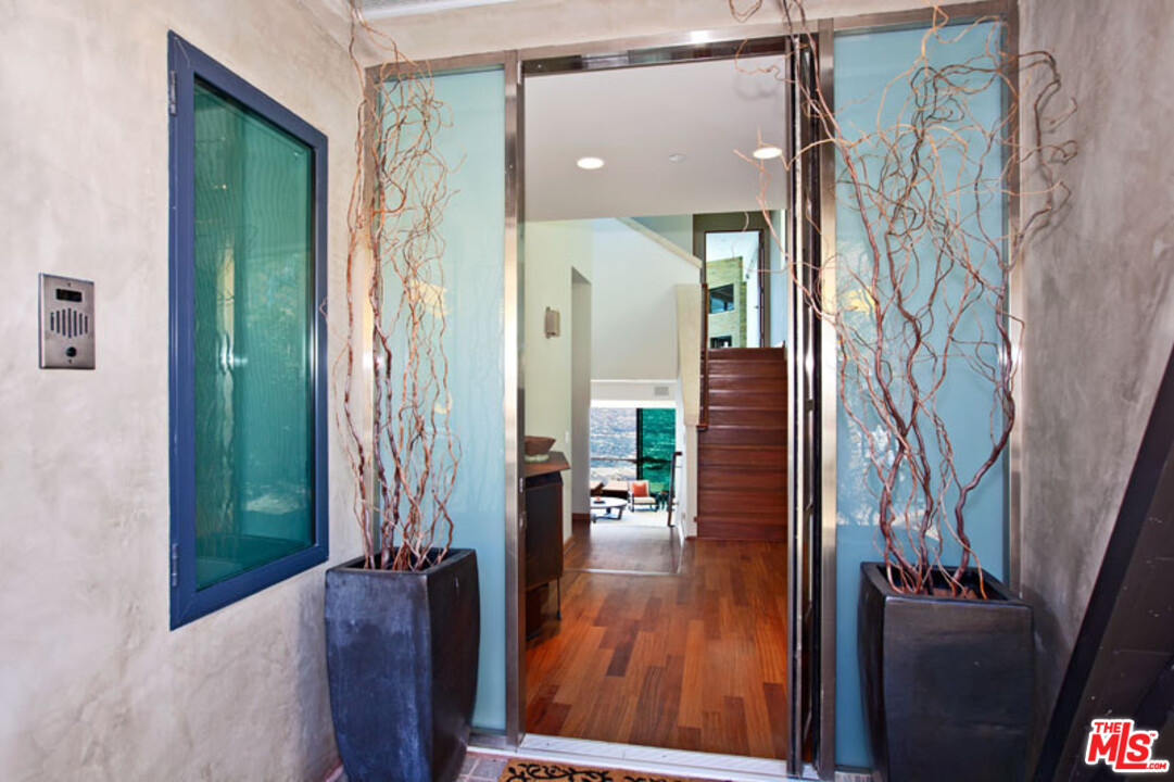 25250 Malibu Road Malibu, CA 90265 - Photo 7 of 31 view of living room with furniture and wooden floor