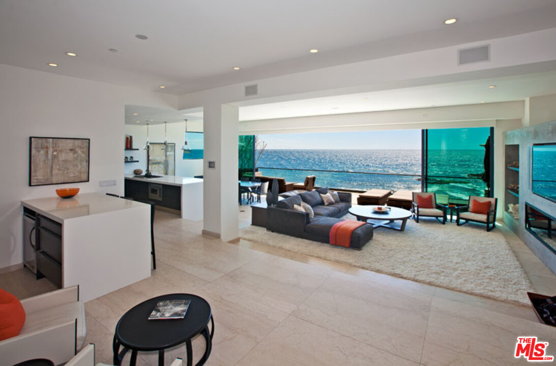 25250 Malibu Road Malibu, CA 90265 - Photo 8 of 31 a living room with furniture and a flat screen tv