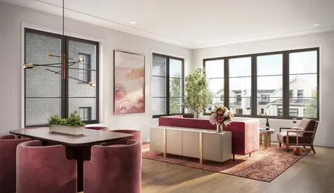 a bathroom with a double vanity sink a toilet and shower