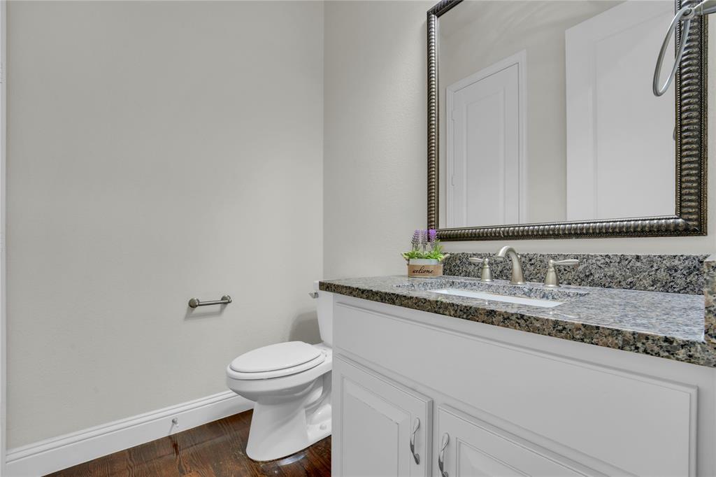 1011 Prairie Ridge Lane Arlington, TX 76005 - Photo 22 of 32 Bathroom featuring a vanity with a granite countertop, white cabinetry, undermount sink, and brushed nickel fixtures