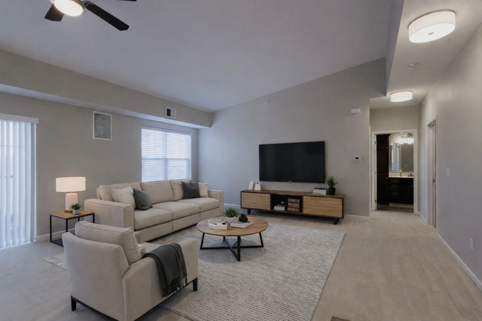 2592 Middle Road, Unit 313 Bettendorf, IA 52722 - Photo 19 of 52 a living room with furniture and a flat screen tv