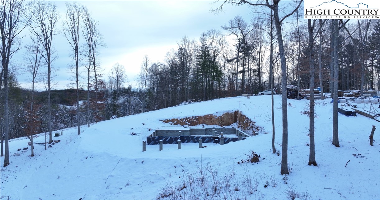 403 Autumn Leaf Way Crumpler, NC 28617 - Photo 12 of 45 a view of a backyard with sitting area