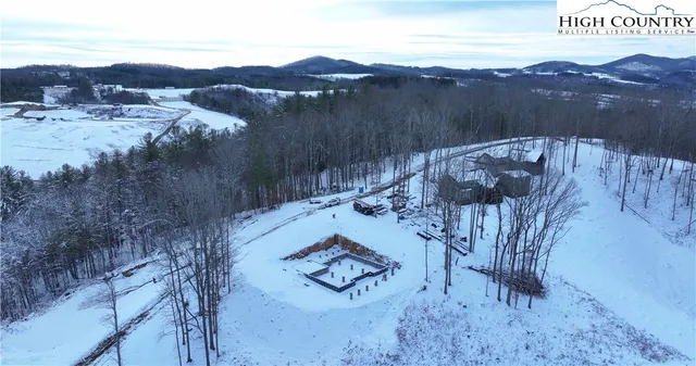 a view of a backyard with sitting area