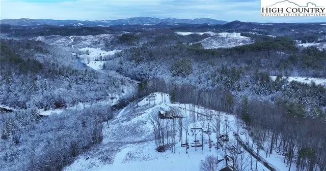 a view of a dry yard with mountains