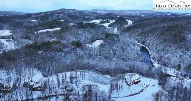 a view of a house with a mountain forest