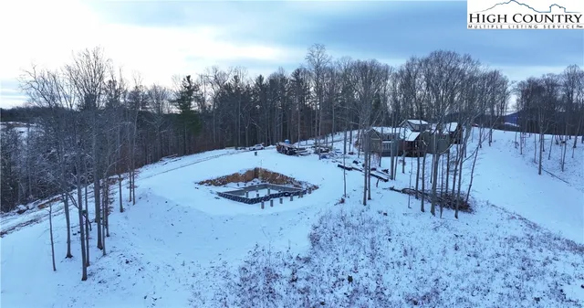 a view of a backyard with sitting area