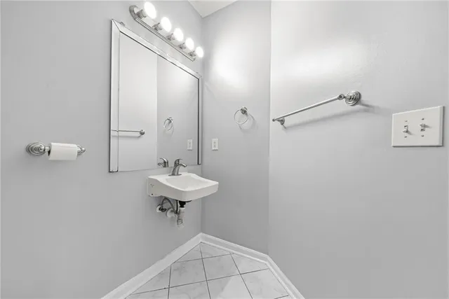 a bathroom with a sink a mirror and a shower