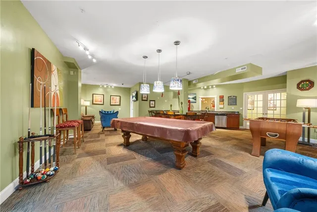 a lobby with furniture and rug