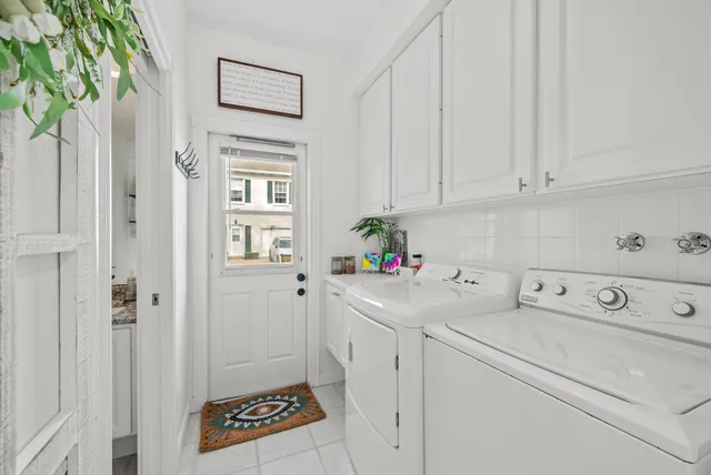 a utility room with closet dryer and washer