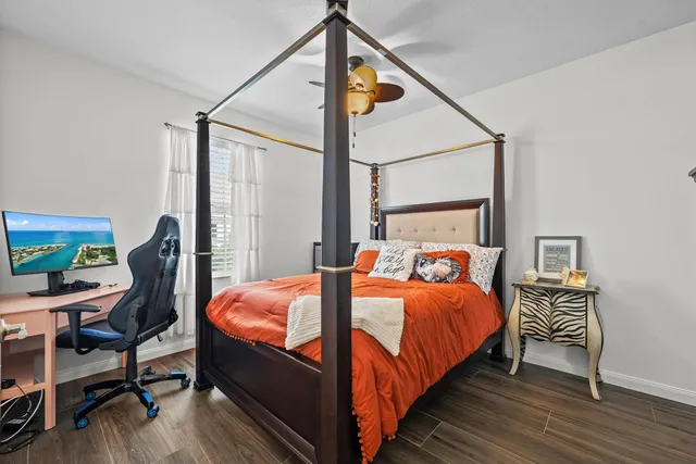 a bedroom with bed and a window