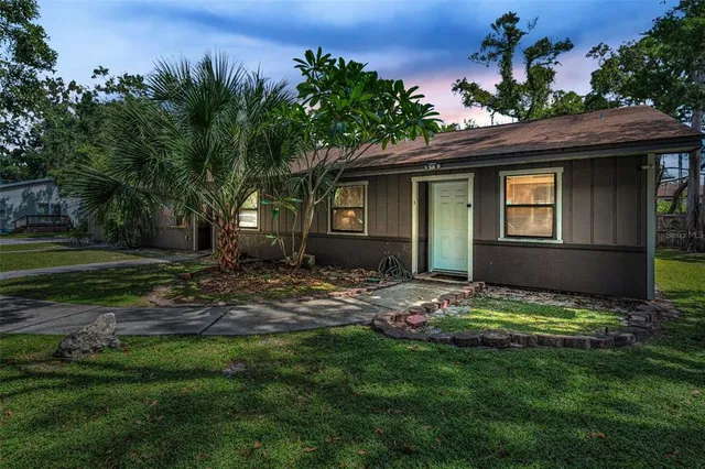 a view of a house with a yard