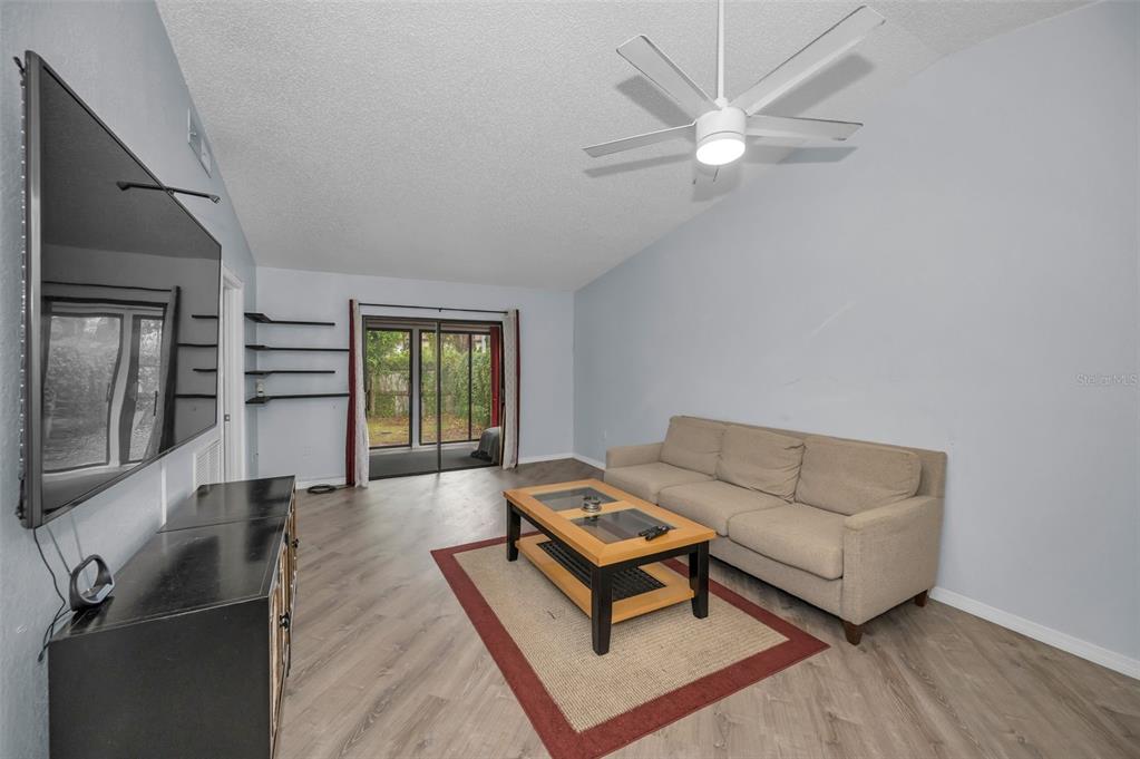 1890 Wolford Road, Unit 3 Clearwater, FL 33760 - Photo 11 of 47 a living room with furniture and a window
