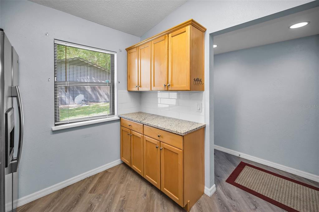 1890 Wolford Road, Unit 3 Clearwater, FL 33760 - Photo 21 of 47 a view of cabinets and window