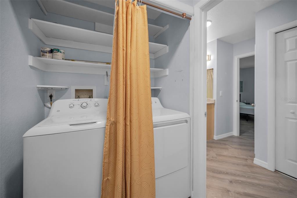 1890 Wolford Road, Unit 3 Clearwater, FL 33760 - Photo 31 of 47 a utility room with dryer and washer