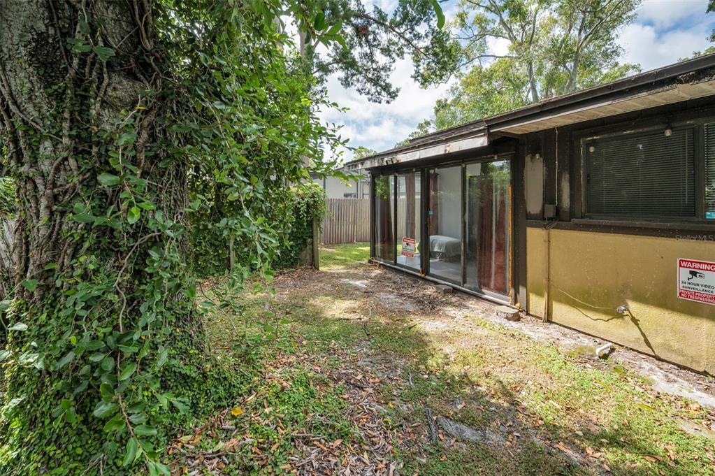 1890 Wolford Road, Unit 3 Clearwater, FL 33760 - Photo 41 of 47 a backyard of a house with lots of green space