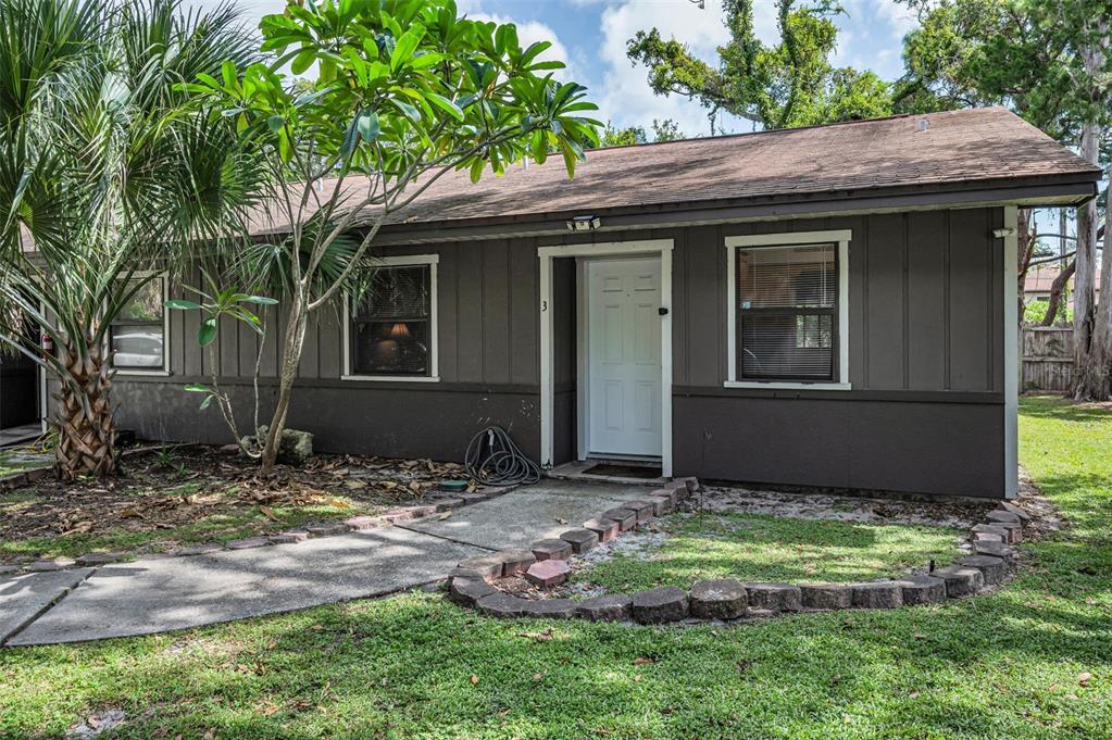 1890 Wolford Road, Unit 3 Clearwater, FL 33760 - Photo 7 of 47 a backyard of a house with lots of green space