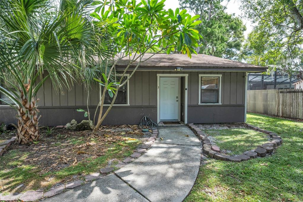 1890 Wolford Road, Unit 3 Clearwater, FL 33760 - Photo 8 of 47 a view of a house with yard and tree in front of it