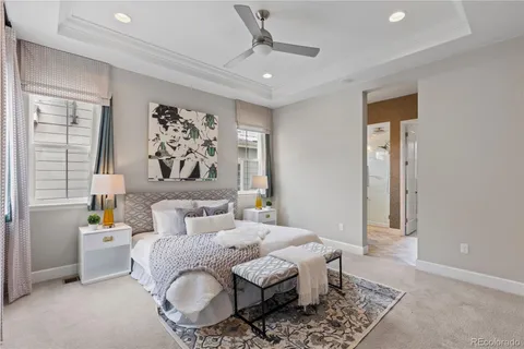 a spacious bedroom with a bed and a window