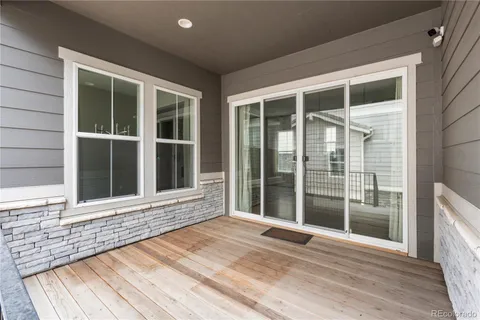 a view of a brick house with large windows