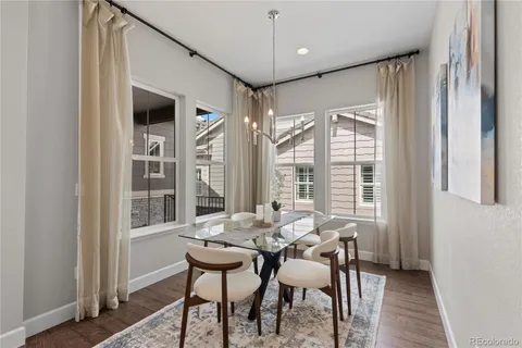 a view of a dining room with furniture window and outside view