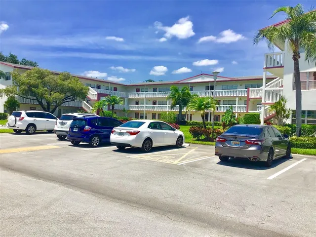 a front view of building with yard