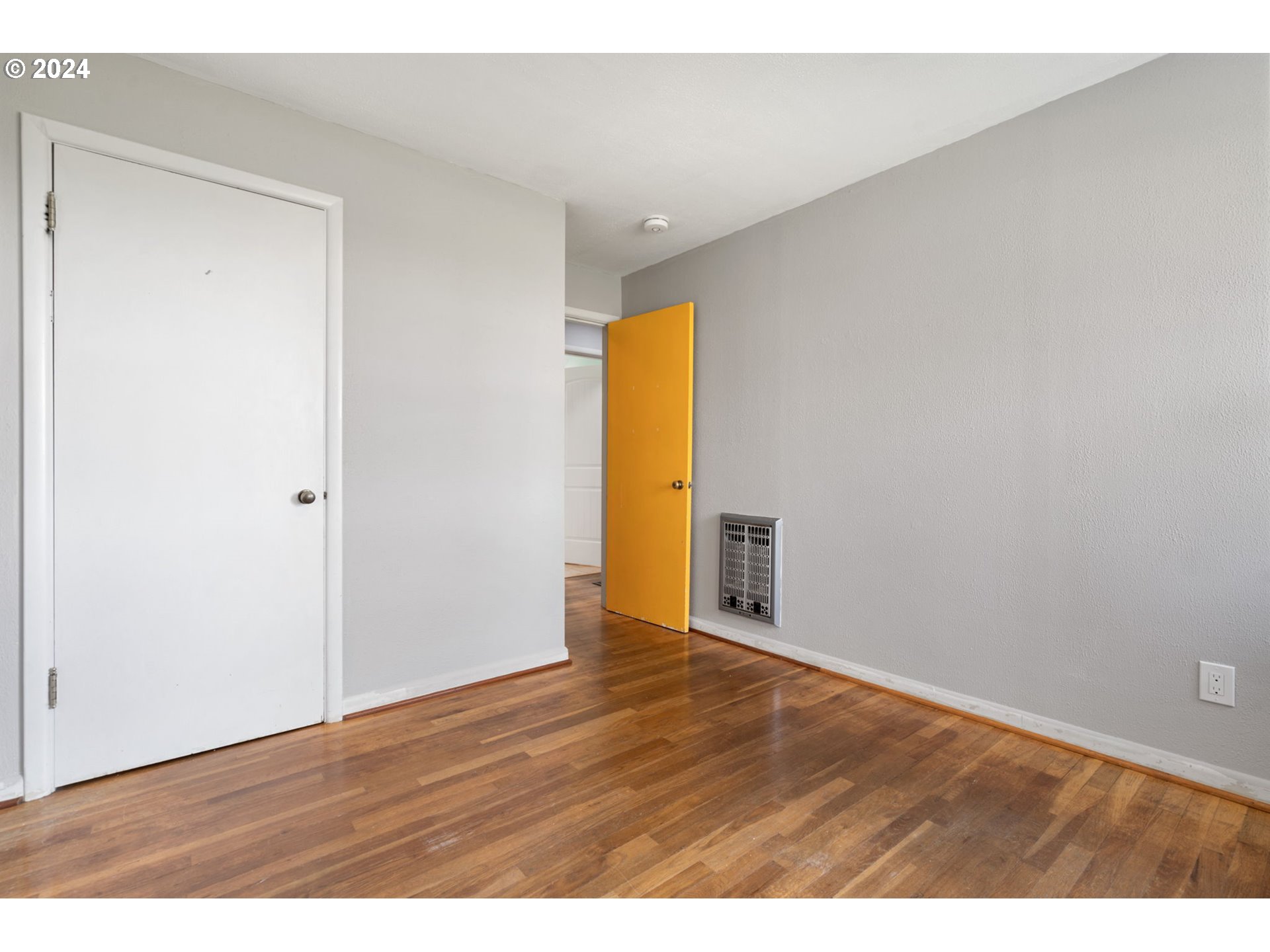 2150 East Airport Road Hermiston, OR 97838 - Photo 13 of 37 a view of an empty room with wooden floor