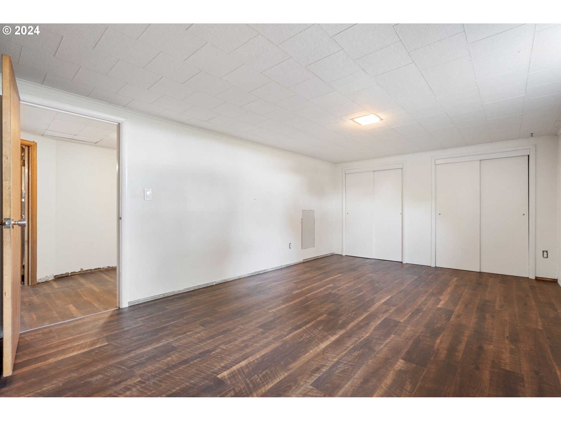 2150 East Airport Road Hermiston, OR 97838 - Photo 20 of 37 a view of an empty room with wooden floor