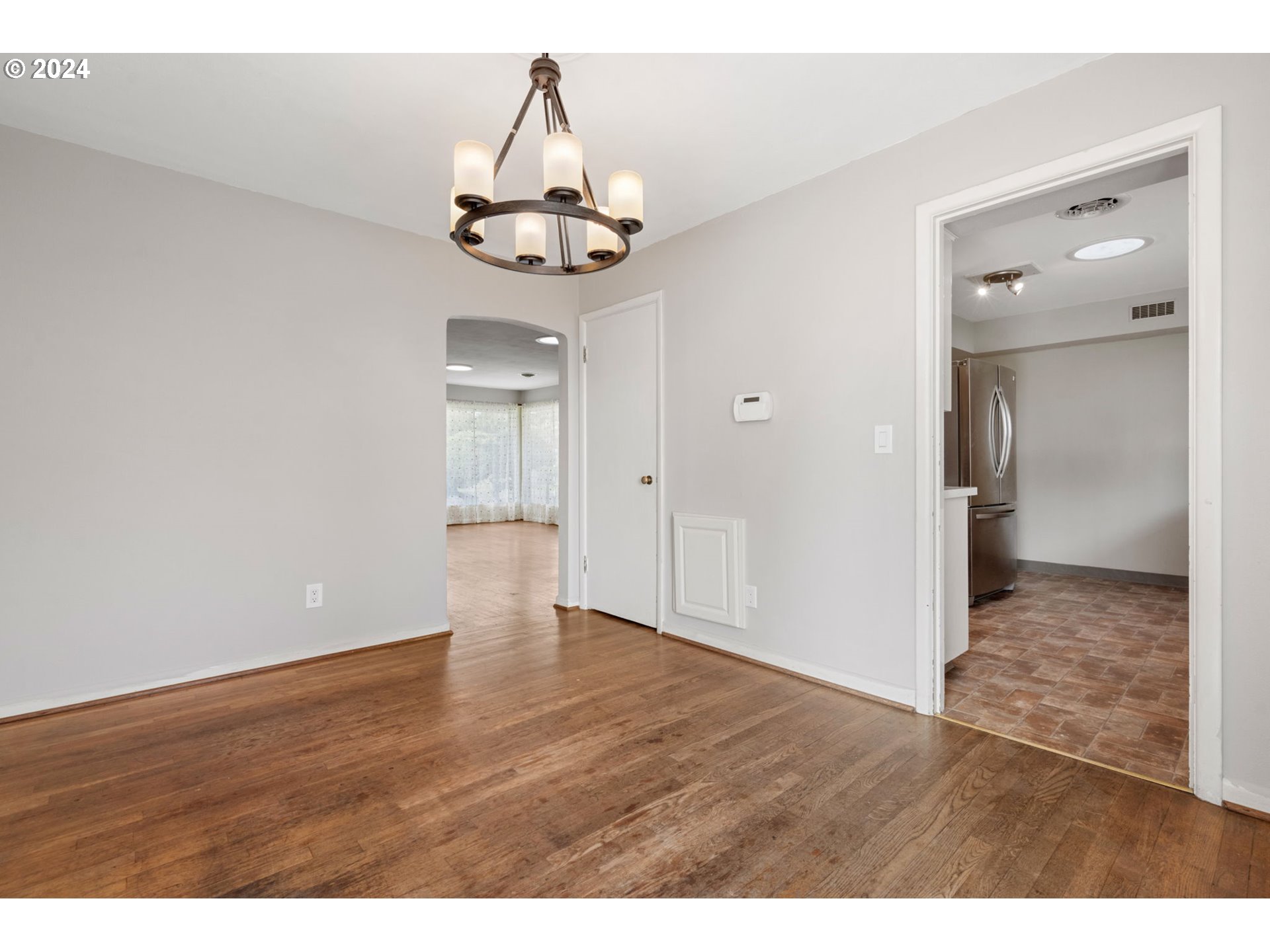 2150 East Airport Road Hermiston, OR 97838 - Photo 7 of 37 a view of an empty room and wooden floor