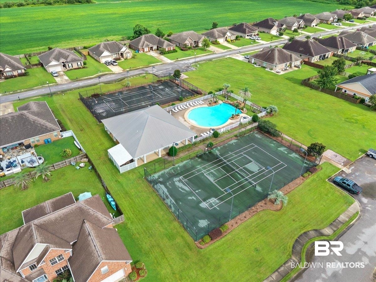 7056 Rocky Rd Loop Gulf Shores, AL 36542 - Photo 40 of 41 Aerial perspective of suburban area featuring a pool
