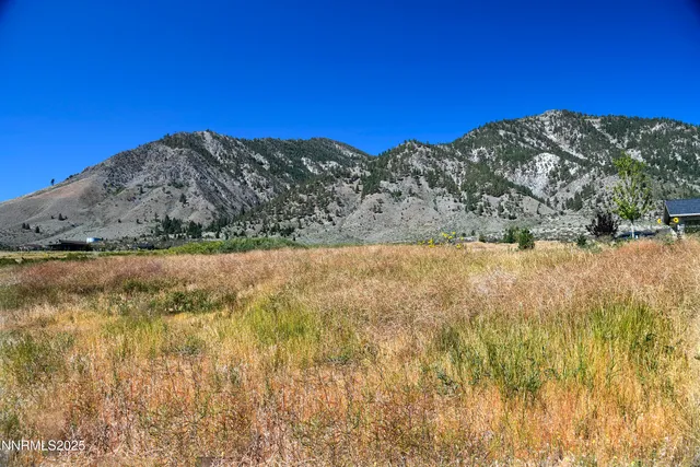 a view of ocean with a building in the background