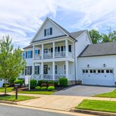 a view of a swimming pool with a garden and seating area