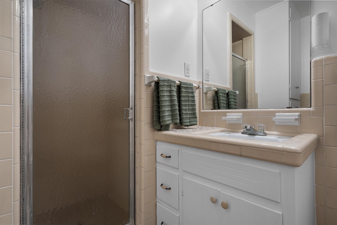 Undisclosed Address Temple, TX 76504 - Photo 11 of 18 a bathroom with a sink and a mirror