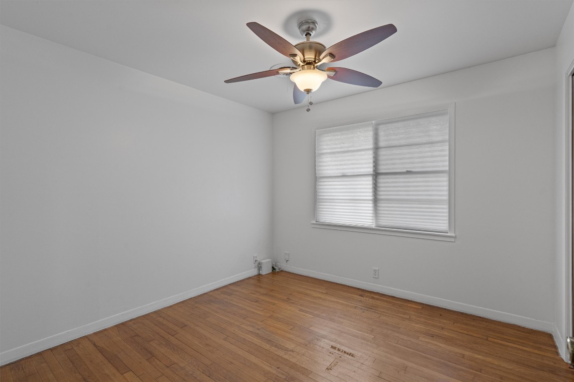 Undisclosed Address Temple, TX 76504 - Photo 14 of 18 an empty room with wooden floor fan and windows