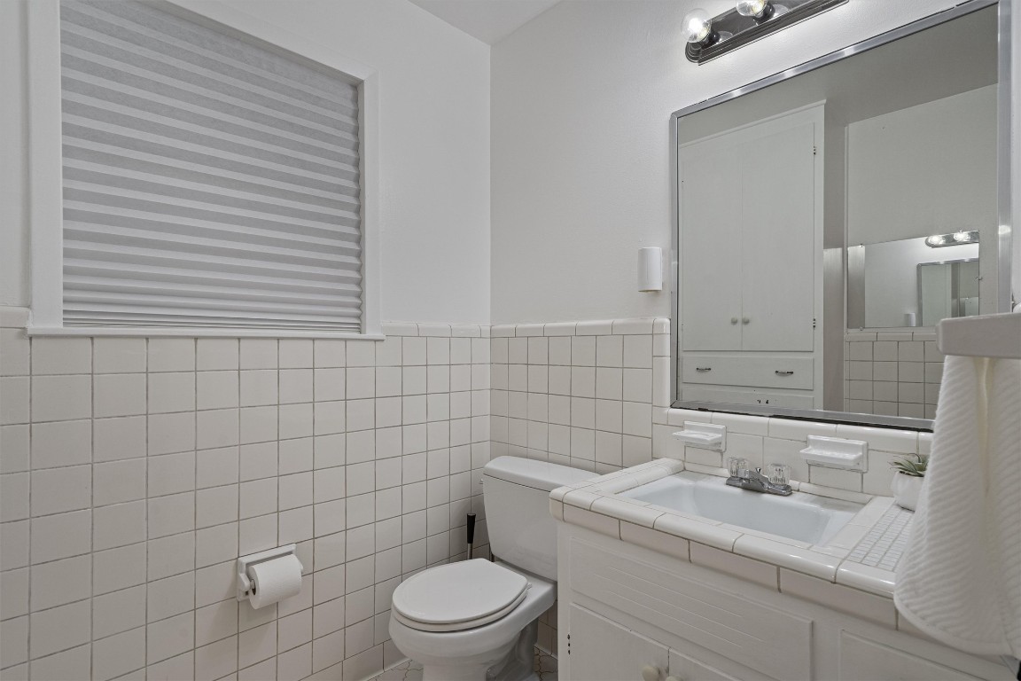 Undisclosed Address Temple, TX 76504 - Photo 15 of 18 a bathroom with a toilet a sink a mirror and shower