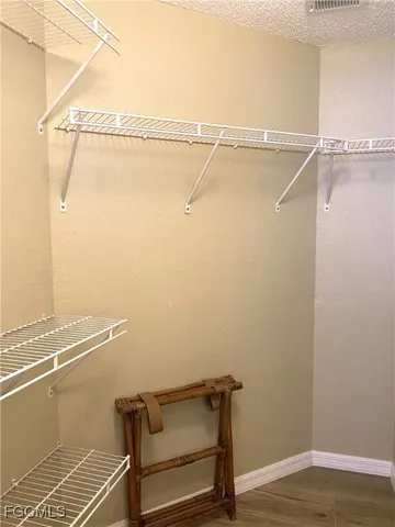 a view of a room with racks on the wall