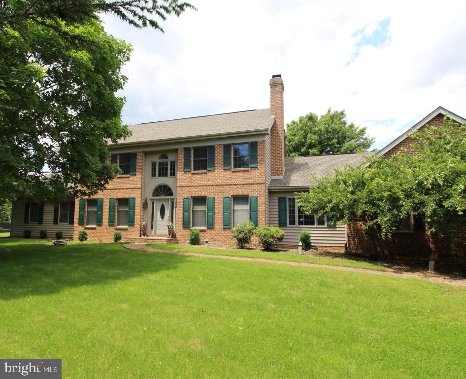 546 Koser Road Lititz, PA 17543 - Photo 2 of 30 a front view of a house with a yard table and chairs
