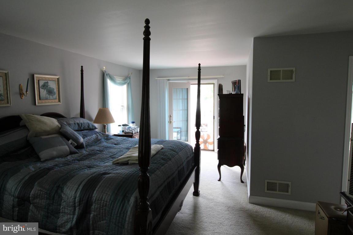 546 Koser Road Lititz, PA 17543 - Photo 12 of 30 a bed room with a bed next to a window