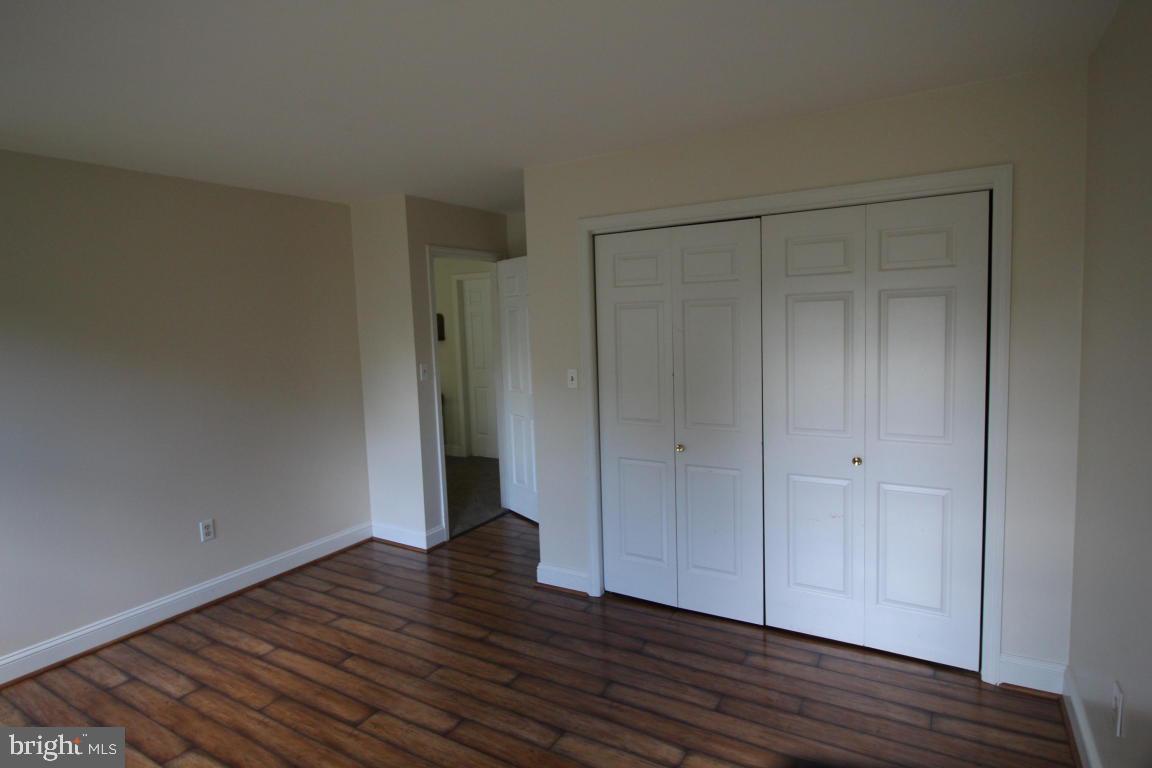 546 Koser Road Lititz, PA 17543 - Photo 15 of 30 a view of an empty room with wooden floor