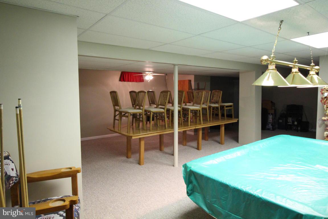 546 Koser Road Lititz, PA 17543 - Photo 24 of 30 a dining room with furniture and a fireplace