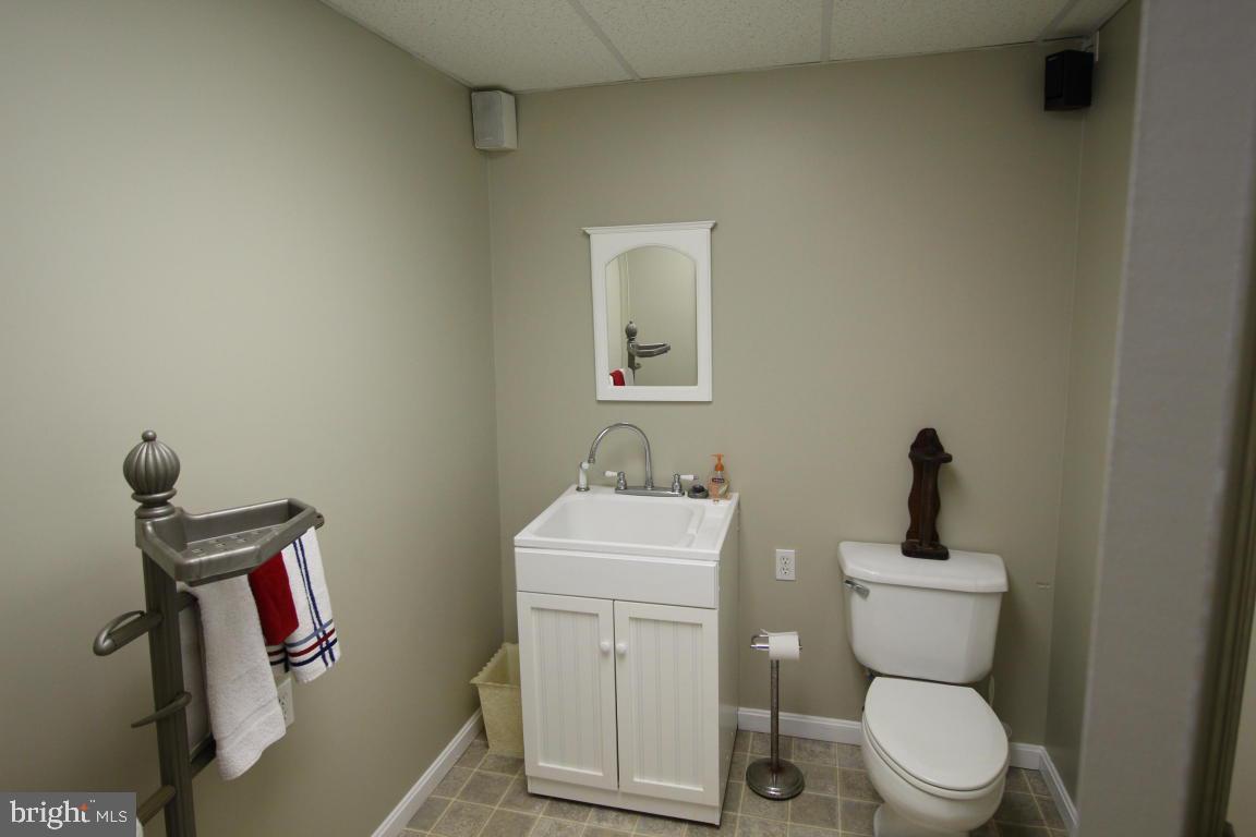 546 Koser Road Lititz, PA 17543 - Photo 28 of 30 a bathroom with a toilet a sink and mirror