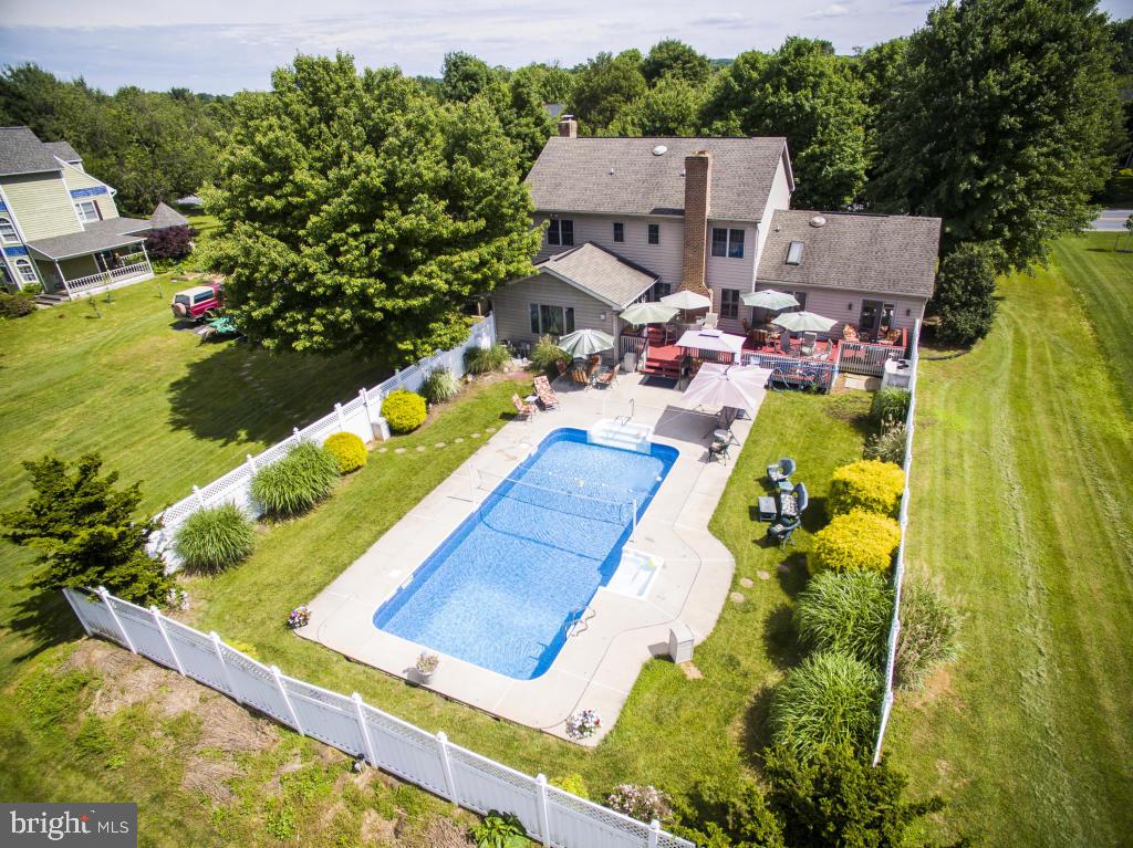546 Koser Road Lititz, PA 17543 - Photo 29 of 30 a aerial view of a house with swimming pool and large trees