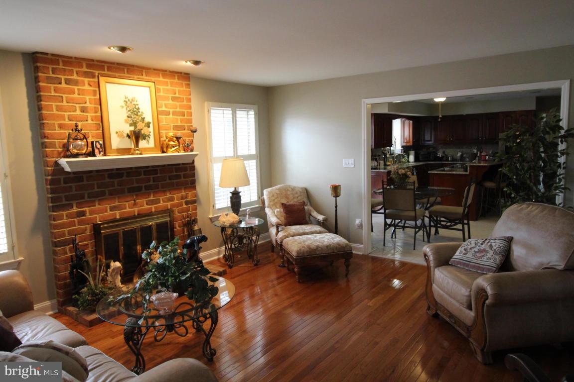 546 Koser Road Lititz, PA 17543 - Photo 6 of 30 a living room with fireplace furniture and a large window