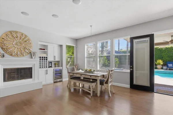 a workspace with furniture window and wooden floor