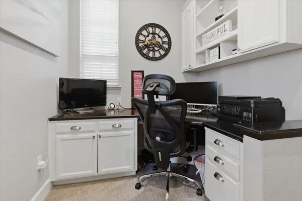 a view of a workspace with furniture