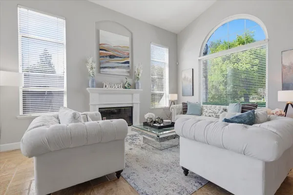 a living room with furniture and a large window